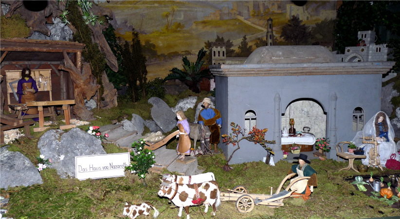 Haus Nazareth, Maria am Spinnrad, Jesusknabe mit Radlbock, Josef in Werkstatt